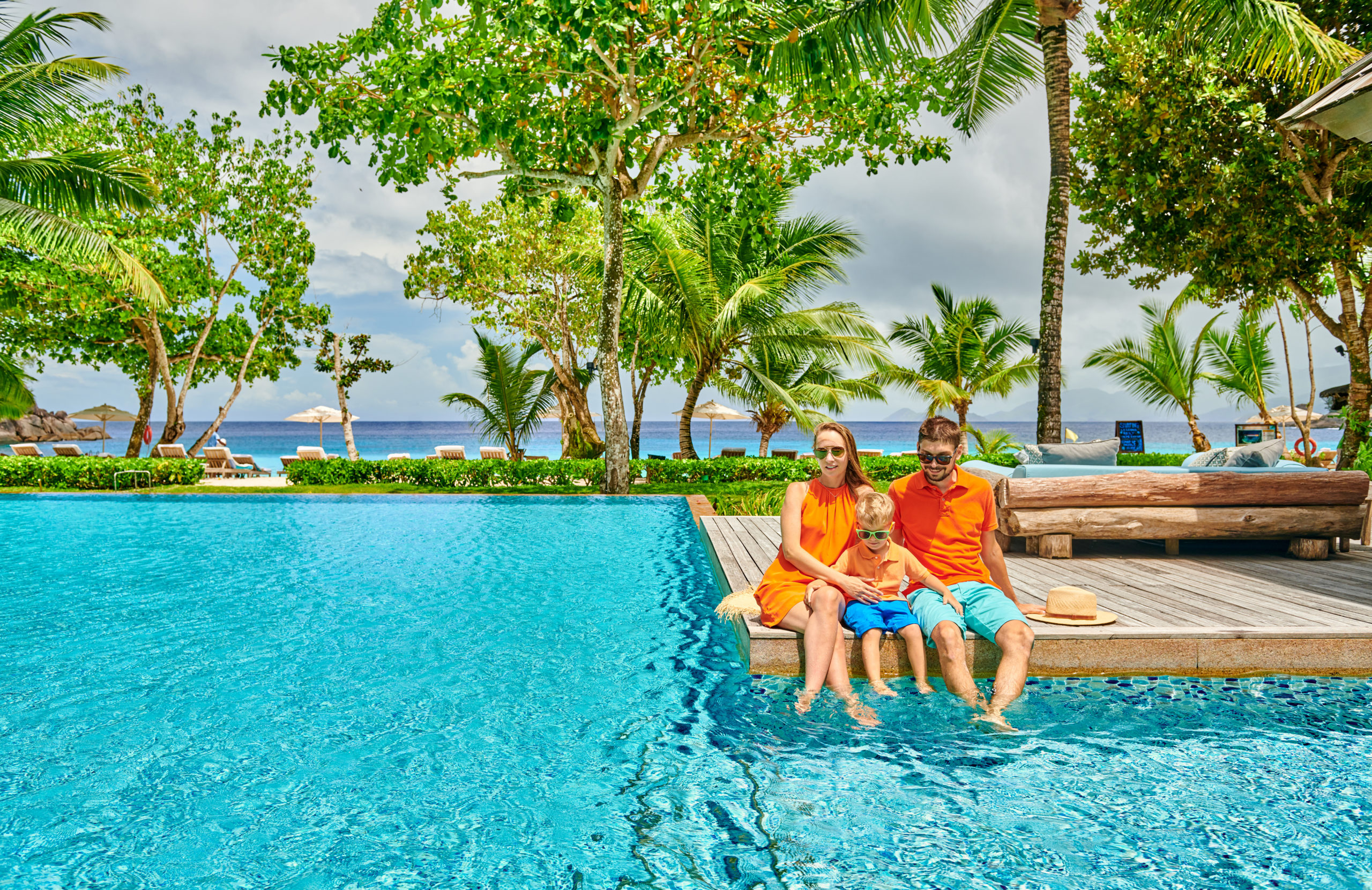 Family Of Three By Poolside Resort Swimming Pool At Seychelles family-of-three-by-poolside-resort-swimming-pool-at-seychelles